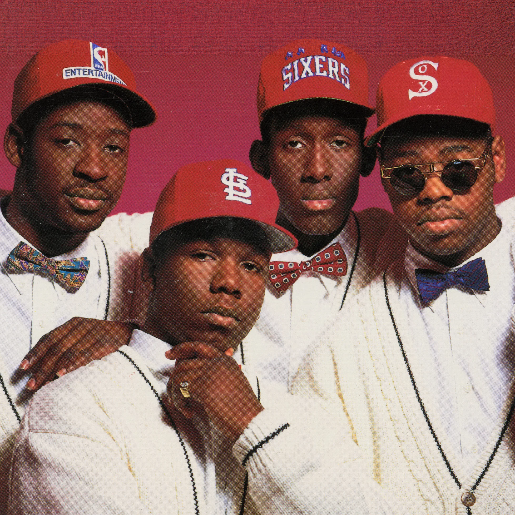 Boyz II Men 1990s promotional photo in red caps and bow ties.