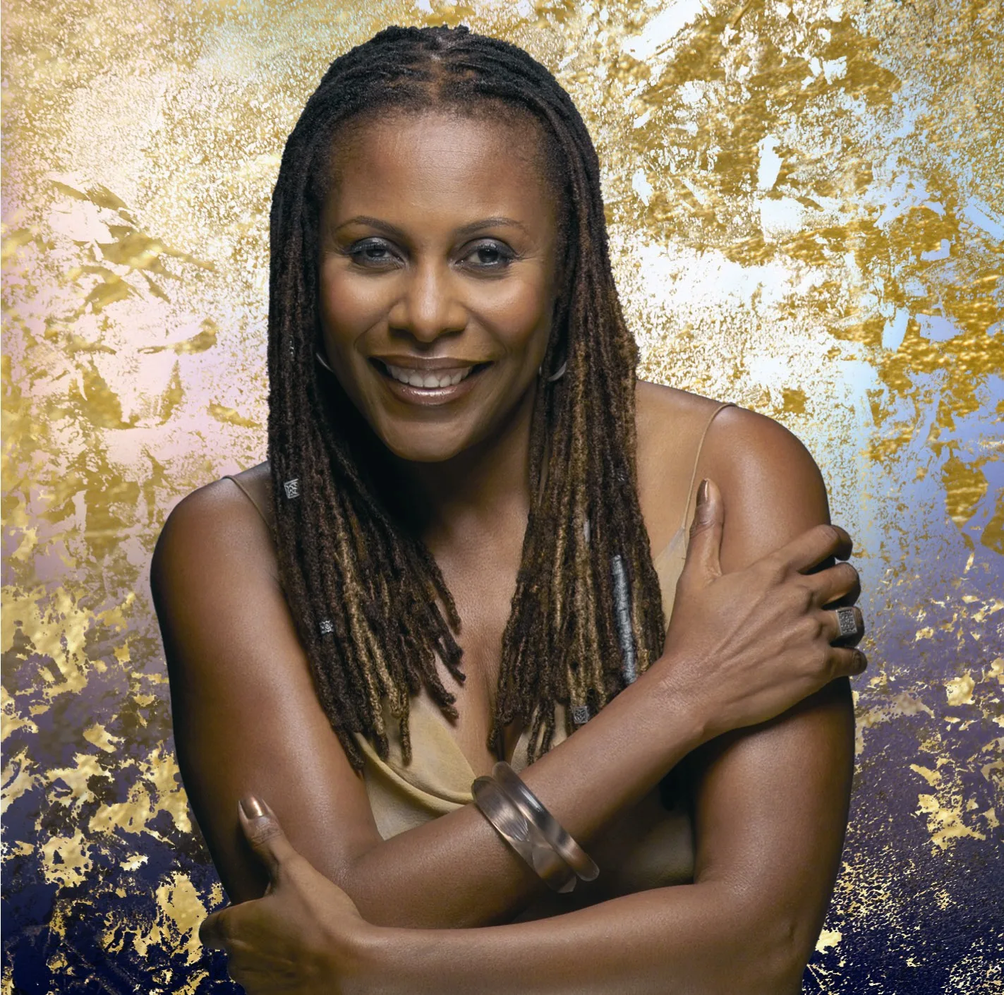 Brenda Russel Portrait with a stylized gold and purple background.