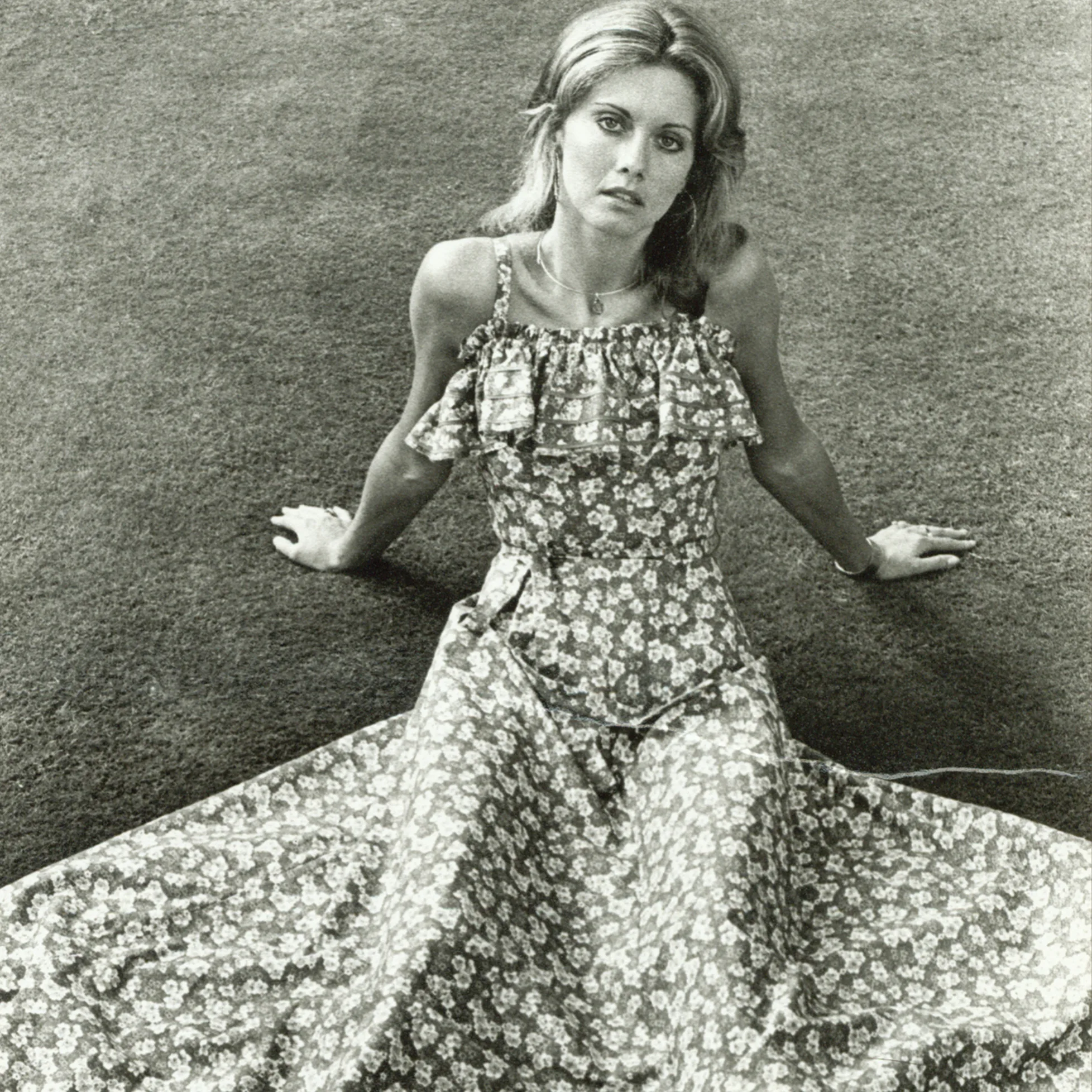 Olivia Newton-John in floral dress portrait.